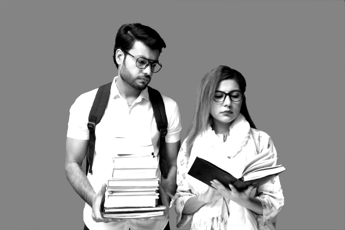 a man and a woman holding books